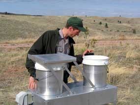 Wind Cave National Park Physical Science Technician Marc Ohms working on air quality monitoring equipment.