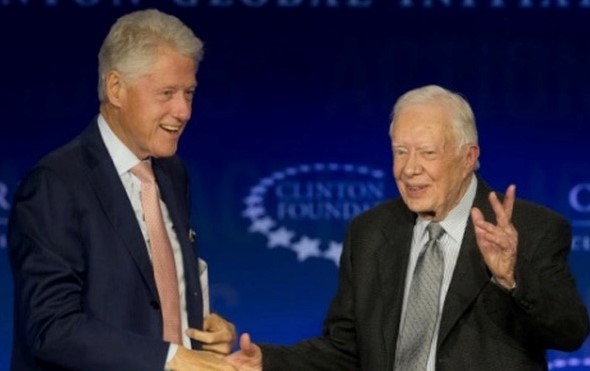 President Clinton and President Carter shaking hands