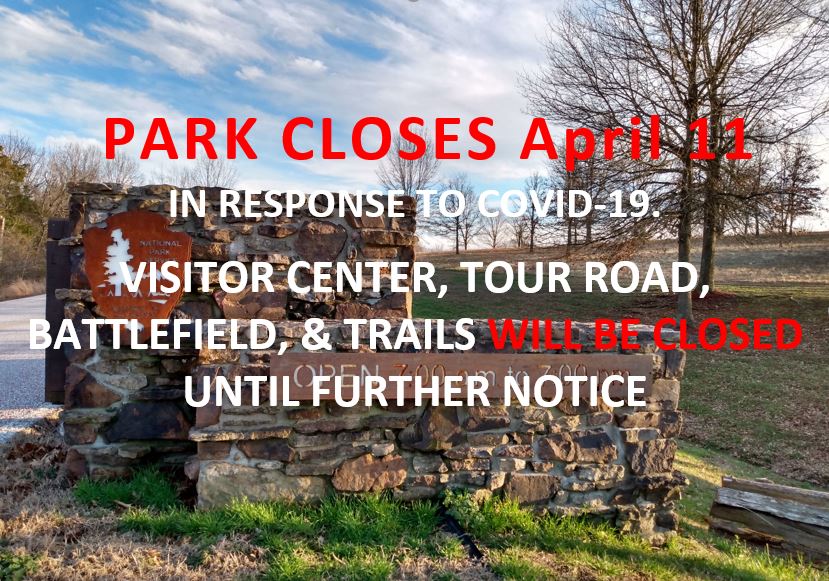 Front gate of park with text information about park closing on April 11