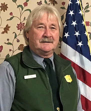 Superintendent Ted Hillmer retires 1-3-2020 Man poses in National Park Service uniform
