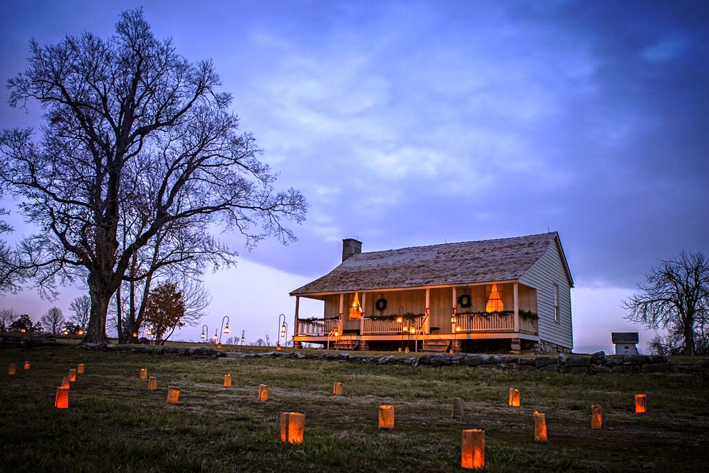 RHLuminary_12-13-14CharlieD Stop 2 tour road picture of the Ray House at night with luminaries honoring those who fought and died at the Battle