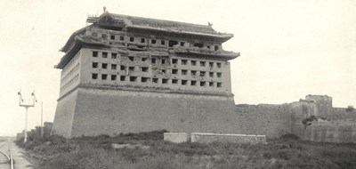 Beijing: Southeast corner guard tower of the Inner City A large chinese building showing facade damage near the roof built of stone