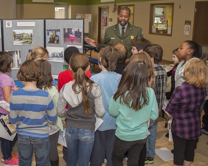 Ranger Wood talks with children