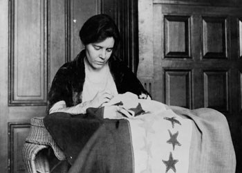 Alice Paul with suffrage flag