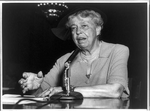 Eleanor Roosevelt, seated, speaking into a microphone, on the United Nations Charter, 1955