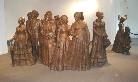 group of life-size bronze statues representing some of the particpants of the First Women's Rights Convention