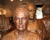 bronze statue of Jane Hunt with her husband Richard Hunt in back bronze statue of Jane Hunt with her husband Richard Hunt in back
