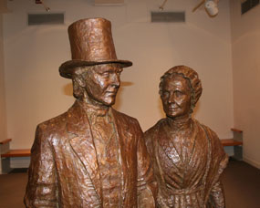 Bronze statues of MaryAnn and Thomas M'Clintock on display in the park visitor center