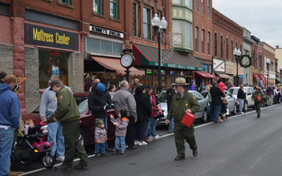 Ranger John hands out bells during the parade.