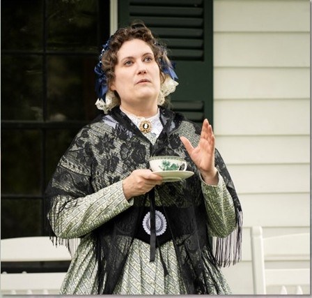 A Woman dressed in 1840's period costume portrays the iconic Elizabeth Cady Stanton.