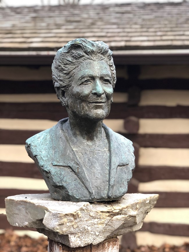 Bust of Catherine Filene Shouse displayed on a stone pedestal.