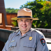 Ken Bigley smiles for a photograph at Wolf Trap National Park for the Performing Arts.