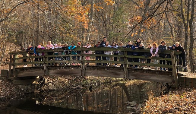 A group of students explore the park's natural side during a field trip.