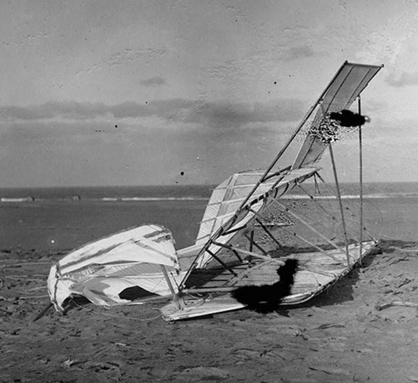 Wrecked glider on sand- Kitty Hawk, 1900