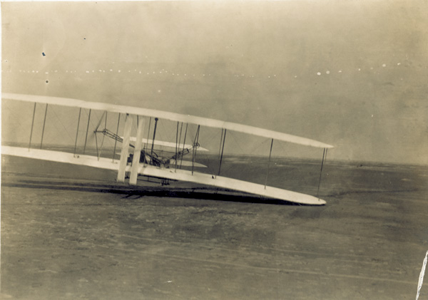 Orville Wright pilots third flight of Dec. 17, 1903. Black and white photo of the Wright flyer on third flight of Dec. 17, 1903.