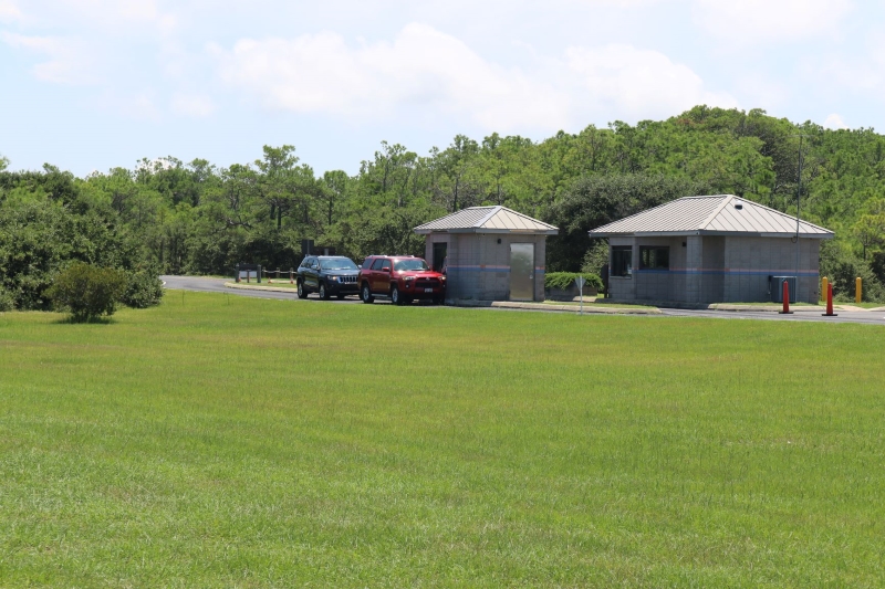 Color photo of two entrance stations at Wright Brothers National Memorial.