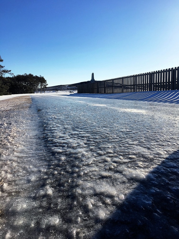 Icy Road at Wright Brothers National Memorial Road with significant ice accumulation leading to Wright Brothers monument