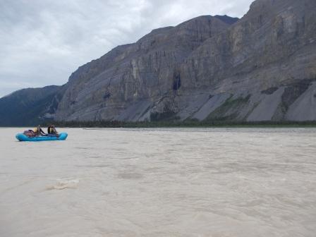 Raft in front of Mile High Cliffs