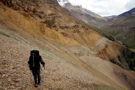 Ranger hiking across scree Ranger hiking across scree