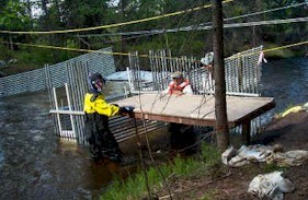 Cleaning the Tanada Creek Fish Weir Cleaning the Tanada Creek Fish Weir