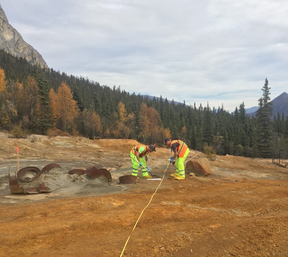 Two workers taking soil samples on the Upper Tailings at the Nabesna Mine Site.