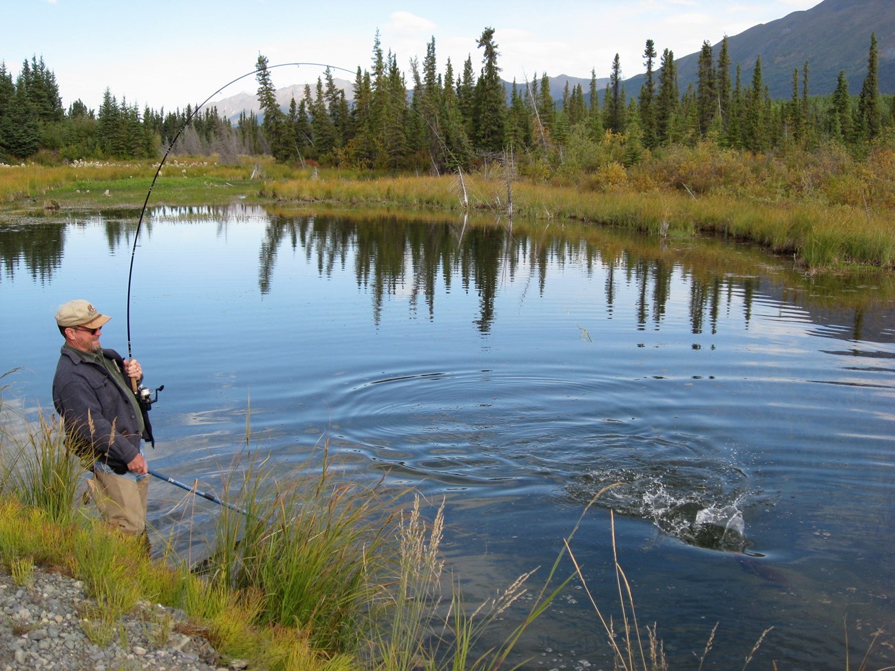 A man fishing on a lake