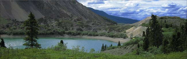Turquoise colored, alpine Soda Lake with mountains in the background. Turquoise colored, alpine Soda Lake with mountains in the background.