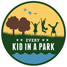 Every Kid in a Park logo featuring children playing in a park. Every Kid in a Park logo featuring children playing in a park.