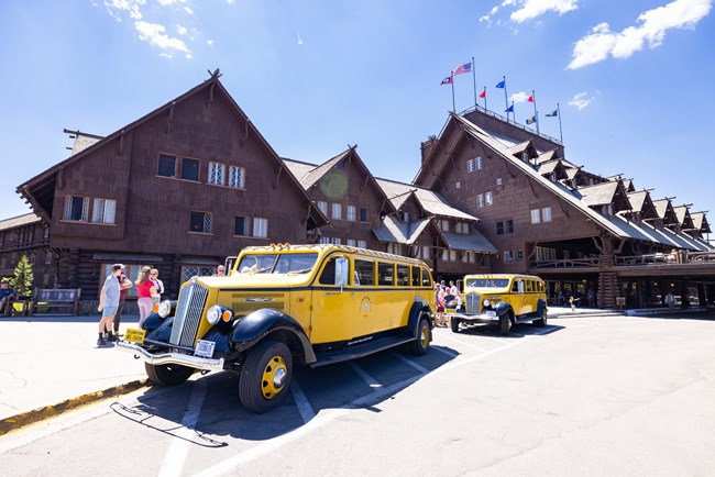 Old Faithful Inn and historic yellow busses