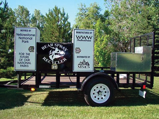 Bear spray recycling units are mounted on a trailer for mobile operations.