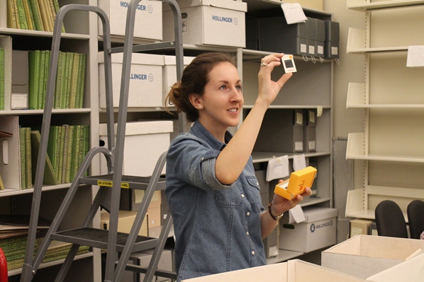 Archives Blitz team 1 member Justine Rothbart examines a slide, September 2014.