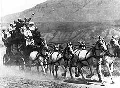Six-horse "Tally-Ho" stagecoach enroute from the Northern Pacific Railroad depot in Gardiner, Montana to Mammoth Hot Springs, taken about 1910. The seats on the roof were reportedly the most sought after by visitors; unfortunately, none of the examples in the park's museum collection retain these seats.