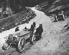 (YELL 21158) Early road construction work in Yellowstone National Park. The vehicles pictured are "Drop Belly" wagons similar to those in the museum collection.