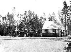 (YELL 90058-2) Shaw & Powell Camping Company group at a tent camp in Yellowstone. The Studebaker mountain stage at left is virtually identical to the example in the park's museum collection. (Montana Historical Society) (YELL 90058-2) Shaw & Powell Camping Company group at a tent camp in Yellowstone. The Studebaker mountain stage at left is virtually identical to the example in the park's museum collection. (Montana Historical Society)