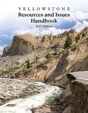 Flood damaged road. Cover of Yellowstone Resources and Issues 2023.