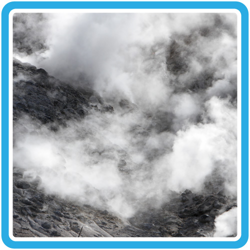 Steam rises up from a barren, rocky hillside.