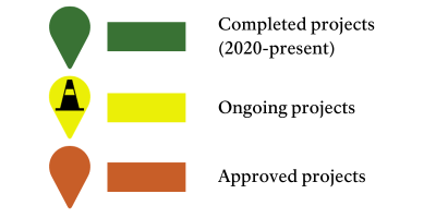 a legend for the map above showing (1) a green map pin and line, indicating completed projects; (2) a yellow map pin and line, indicating ongoing projects; and (3) an orange map pin and line, indicating approved projects.