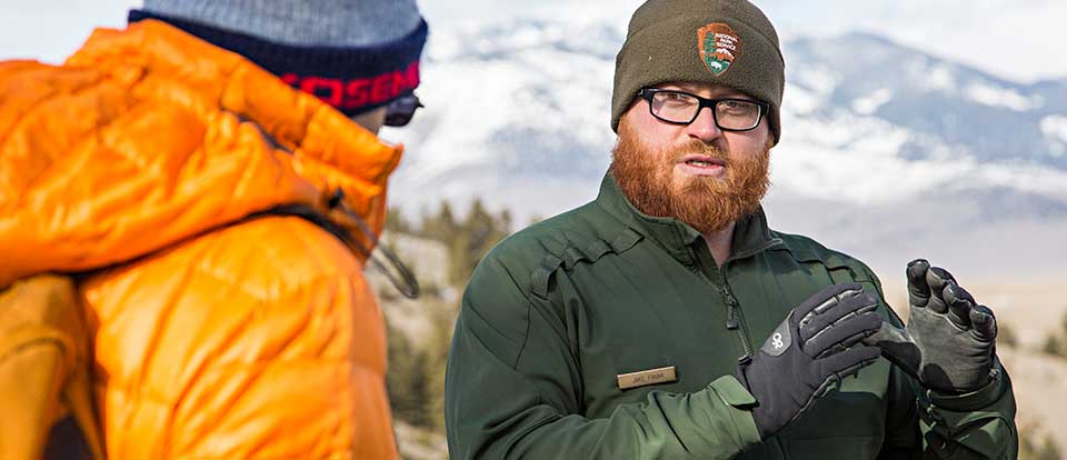 A ranger talking with a visitor. A ranger talking with a visitor.