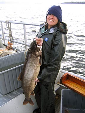 Park staff displaying large fish. Park staff displaying large fish.