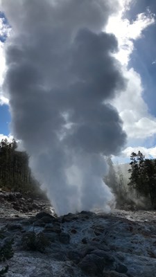 Steam rises from a rocky vent.