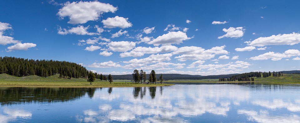 Panoramic view of Yellowstone river with reflected sky.