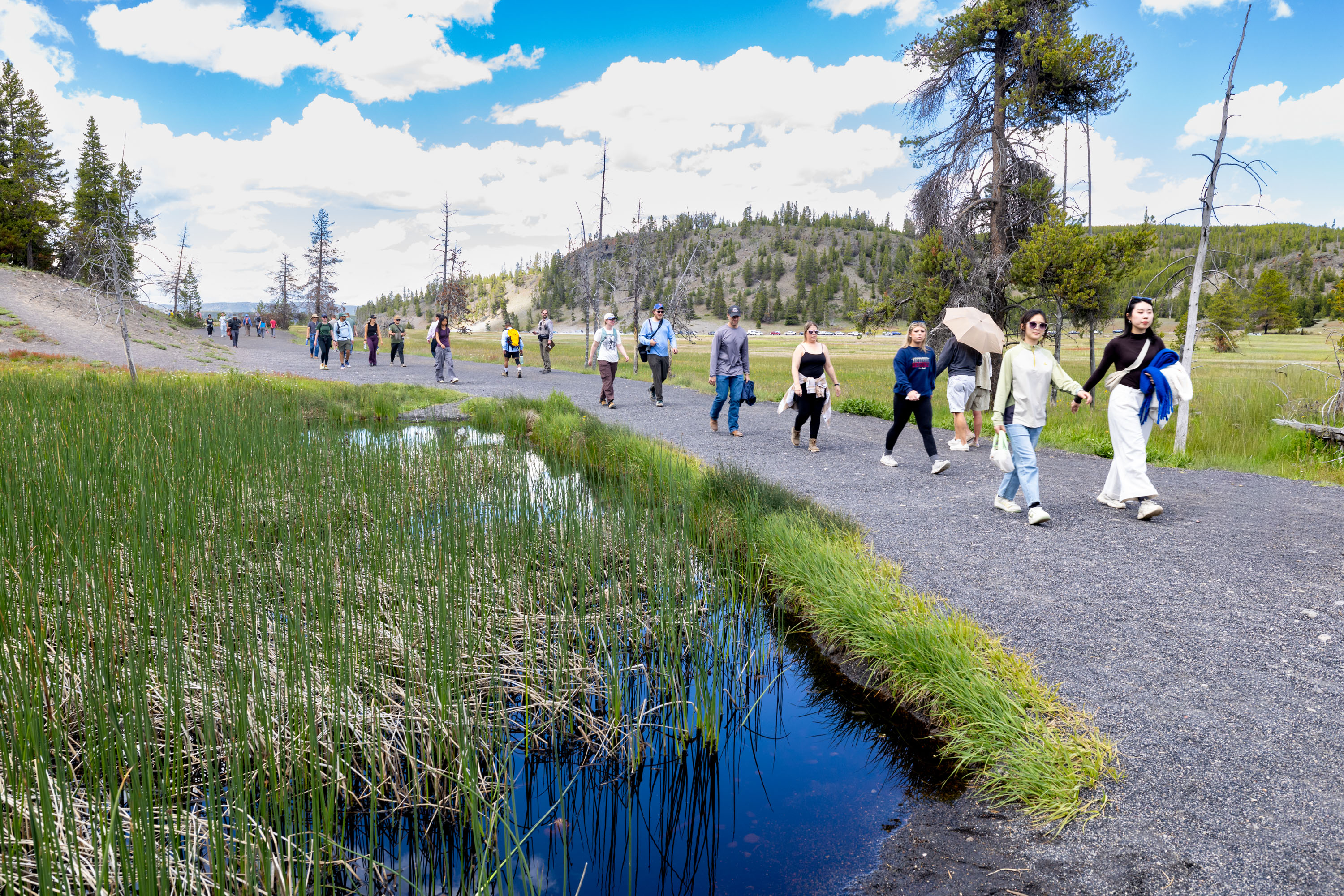 Visitors walk in thermal basin