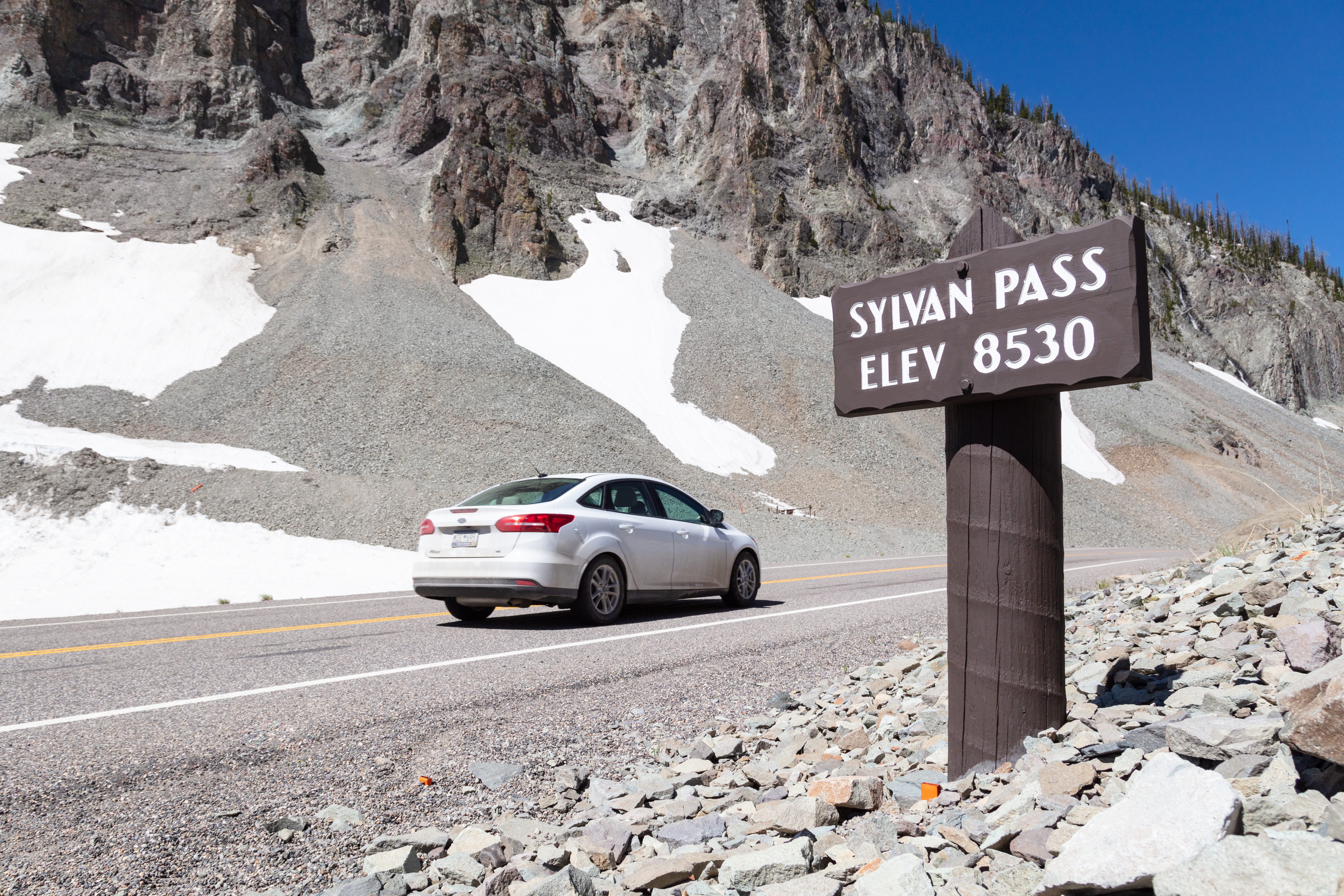 a vehicle driving on a high-elevation road