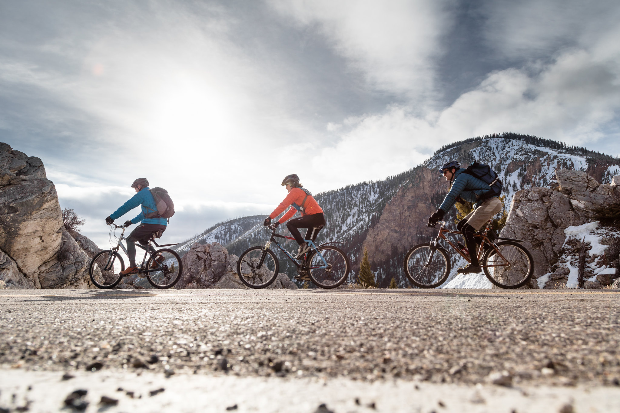 three bikers riding on road