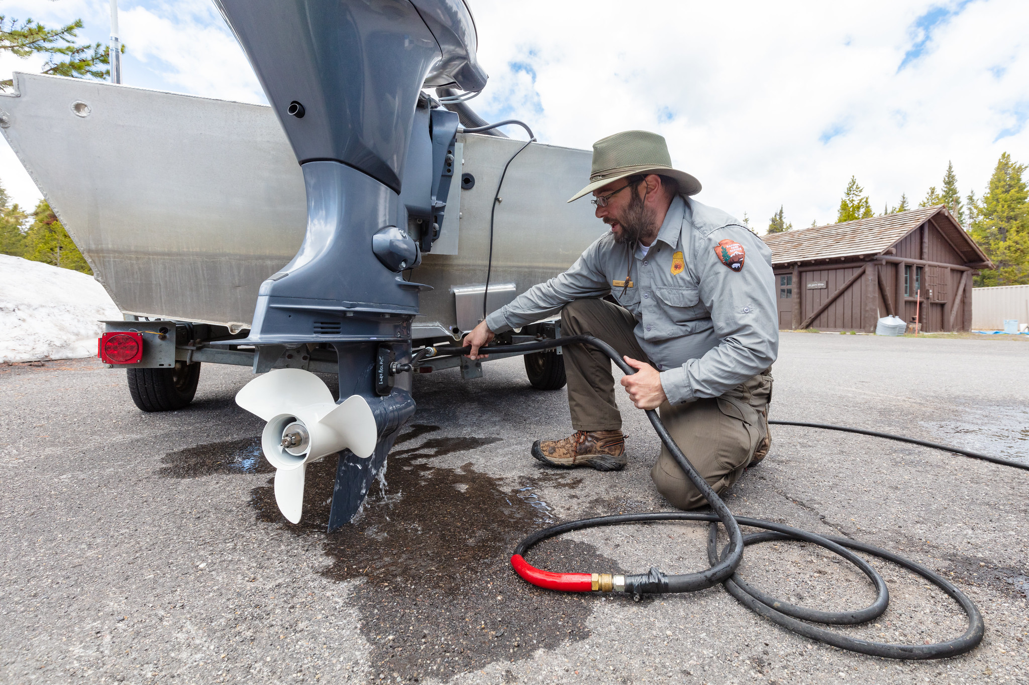 staff decontaminates boat