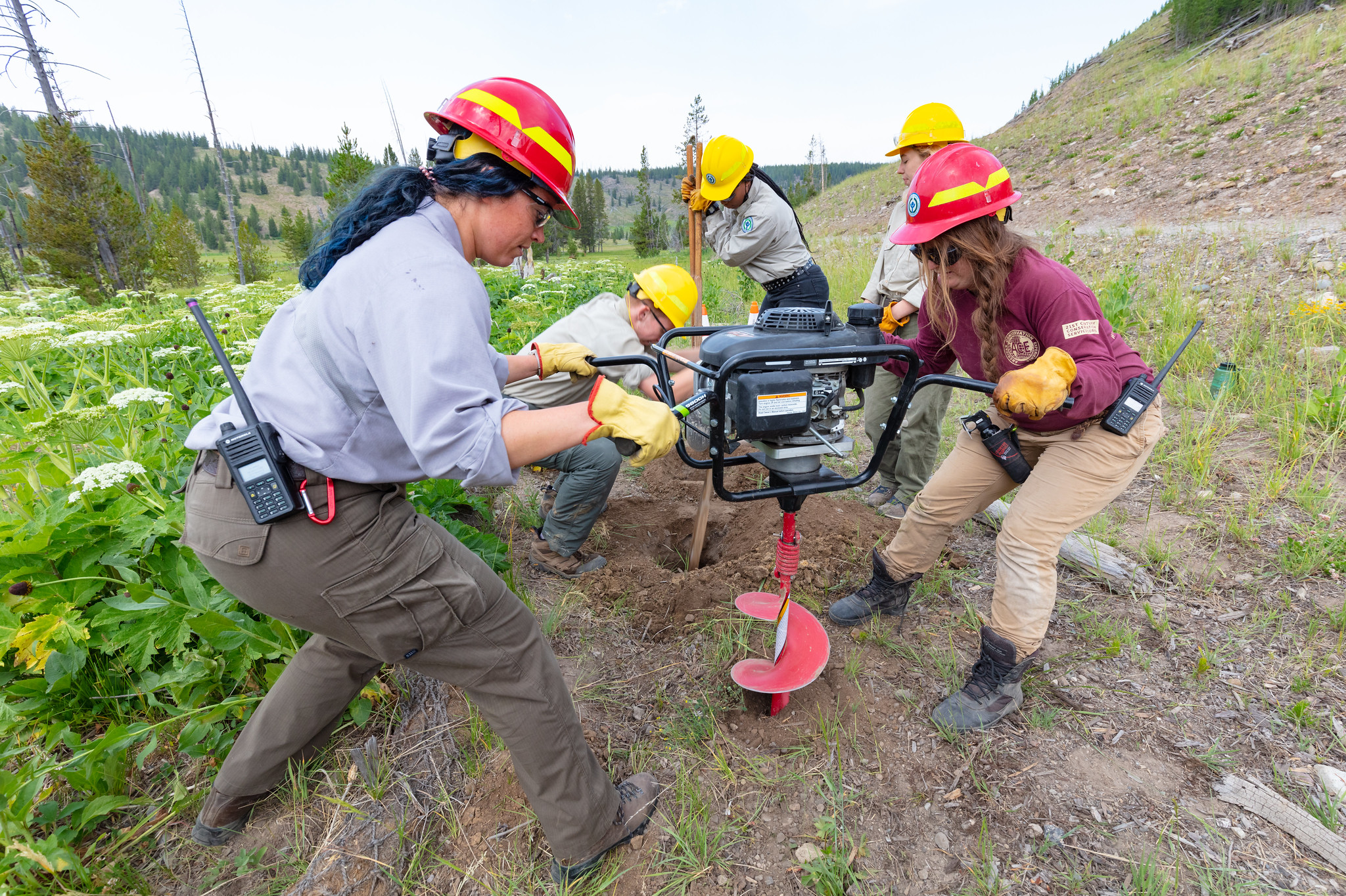 51316213883_185be049f5_k (1) workers use machinery to drill hole in ground