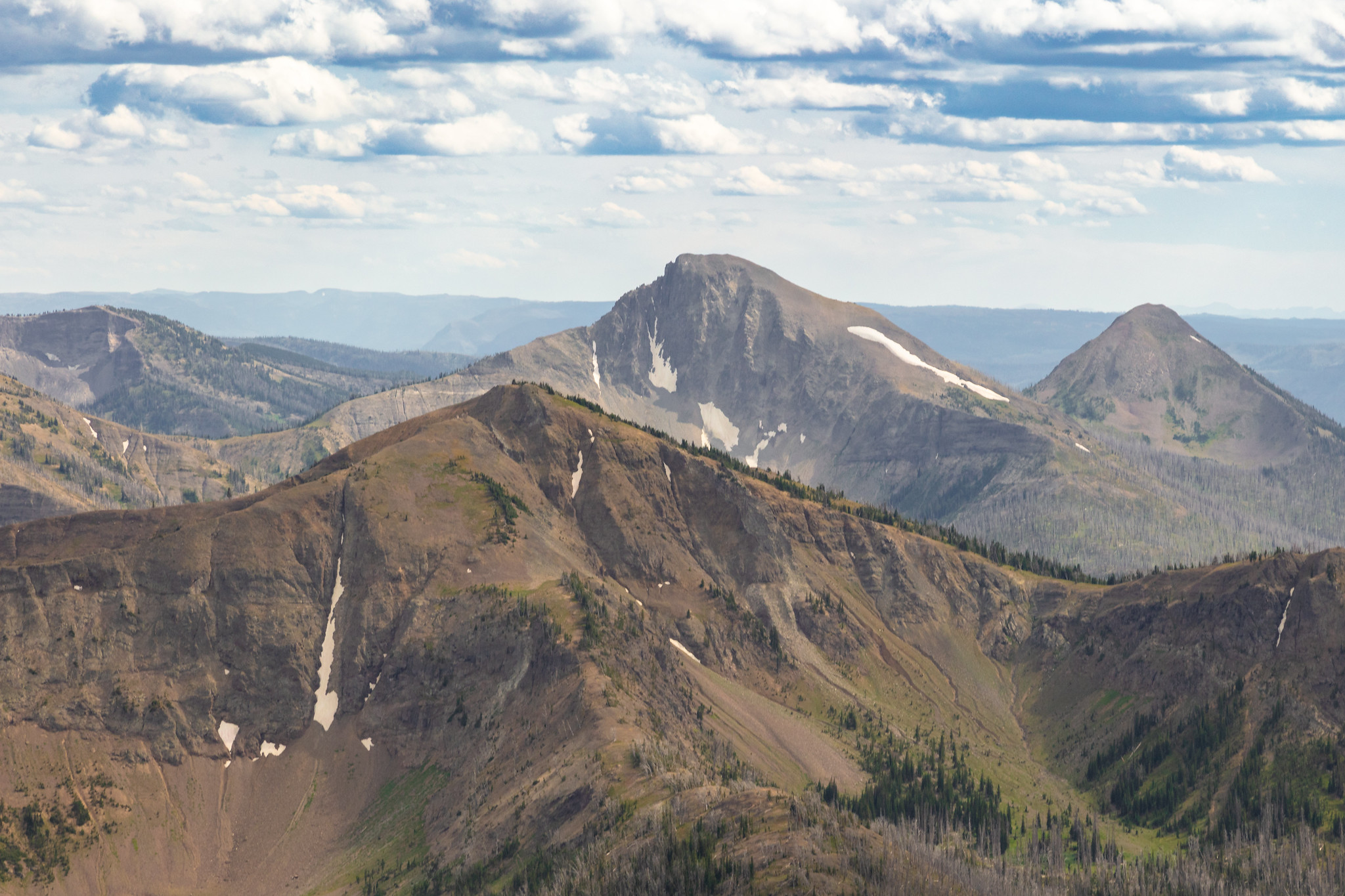 First Peoples Mountain (center) rises between Top Notch Peak (foreground) and Mt. Stevenson (back right) seen from Avalanche Peak NPS / Jacob W. Frank