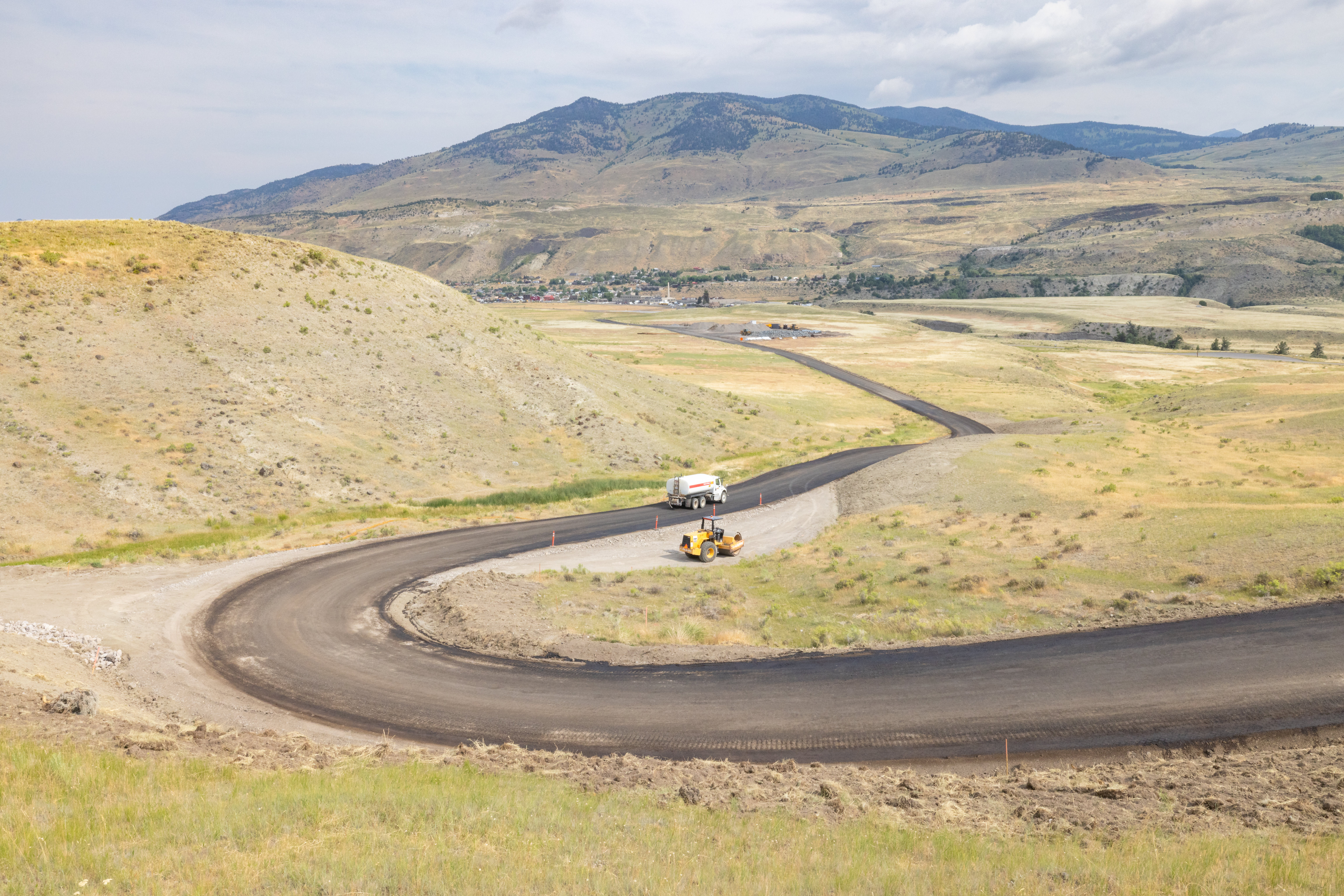 heavy machinery doing construction on a windy road