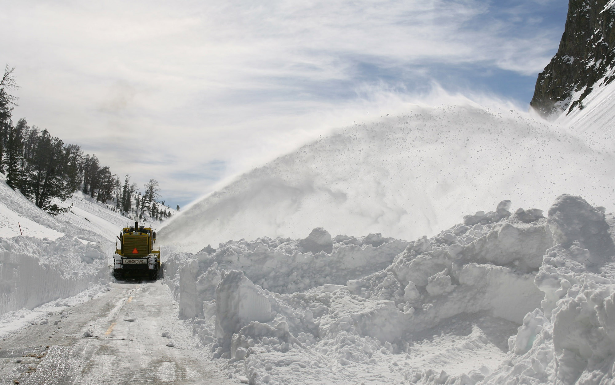 spring snow plowing on roadway