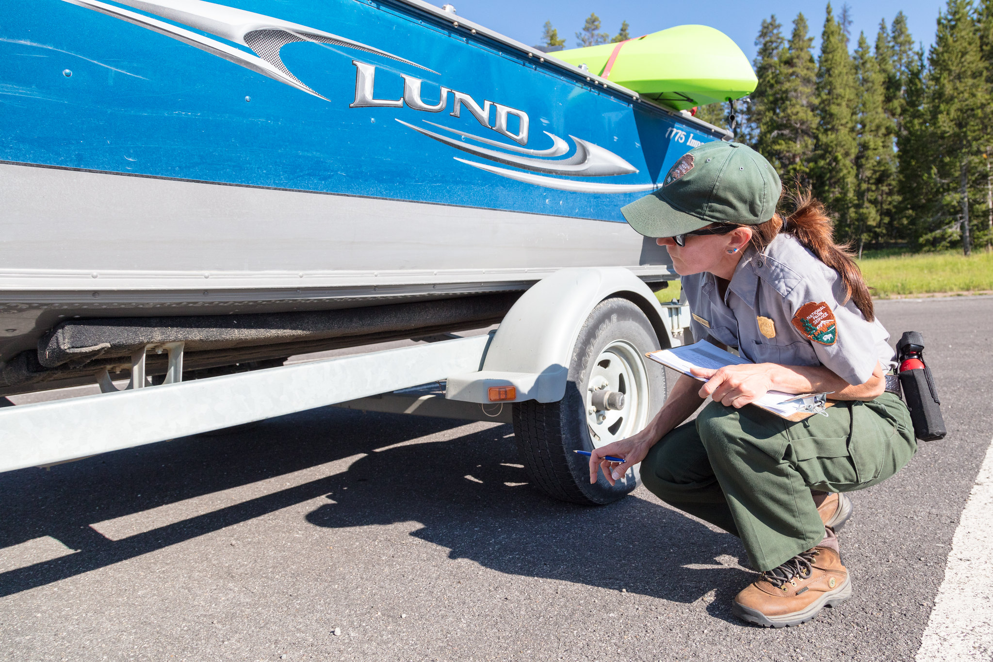 Woman inspection boat in a parking lot